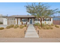 Charming single-story home with desert landscaping, painted brick and a welcoming front porch at 6926 E Culver St, Scottsdale, AZ 85257