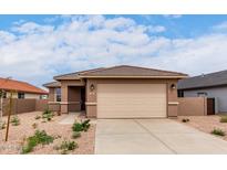 Charming single-story home featuring a neutral color palette, low-maintenance landscaping, and a two-car garage at 7342 E Hackamore Ln, San Tan Valley, AZ 85143