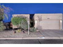 Charming home featuring desert landscaping, a two-car garage, and a tile roof in a quiet neighborhood at 16857 E Deuce Ct, Fountain Hills, AZ 85268