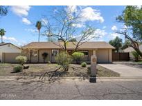 Charming single-story home with a well-maintained front yard and inviting curb appeal at 4257 E Marino Dr, Phoenix, AZ 85032