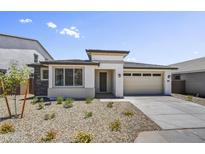 Charming single-story home with a well-manicured desert landscape in a residential neighborhood at 5875 N 193Rd Dr, Litchfield Park, AZ 85340