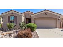 Charming single-story home featuring a two-car garage, desert landscaping, and a welcoming facade at 4203 E Narrowleaf Dr, Gilbert, AZ 85298