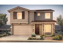 Charming two-story home with a tile roof, stone accents, and a well-manicured desert landscape at 13479 W Cassia Trl, Peoria, AZ 85383