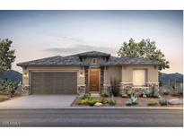 Charming single-story home with desert landscaping, stone accents, and a two-car garage at 13757 W Forest Pleasant Pl, Peoria, AZ 85383