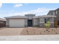 Charming single-story home featuring a two-car garage and meticulously xeriscaped front yard at 13757 W Forest Pleasant Pl, Peoria, AZ 85383