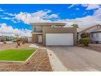 Charming two-story home featuring a spacious two car garage and inviting front yard at 2079 N Sweetwater Dr, Casa Grande, AZ 85122