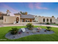 Stunning home exterior boasts meticulous landscaping and charming curb appeal, enhanced by a tiled roof at 7481 E Camino Santo --, Scottsdale, AZ 85260