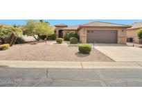 Charming single-story home featuring low-maintenance landscaping and a two-car garage at 16131 W Indianola Ave, Goodyear, AZ 85395