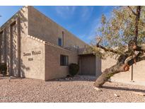 Tan stucco Sonora Villas building featuring desert landscaping at 16616 E Palisades Blvd # 109, Fountain Hills, AZ 85268