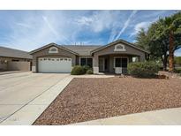 Charming single-story home featuring a two-car garage and desert landscaping for low maintenance at 19622 N 66Th Ln, Glendale, AZ 85308
