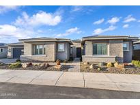 Charming single-story home with stone accents, desert landscaping, and welcoming curb appeal at 2854 E Cashman Dr, Phoenix, AZ 85050