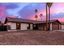 Charming single story home with a large front yard and attached two car garage at 3037 W Libby St, Phoenix, AZ 85053