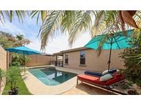 A refreshing backyard pool with lounge chairs and a relaxing patio area, perfect for outdoor living at 6796 W Evergreen Ter, Peoria, AZ 85383