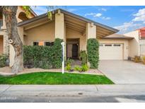 Charming single-story home with a well-manicured lawn and a welcoming front entrance at 7905 E Plaza Ave, Scottsdale, AZ 85250