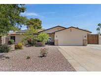 Charming home featuring a desert landscaped front yard and a two-car garage at 12809 N 50Th St, Scottsdale, AZ 85254