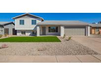 Charming two-story home featuring new landscaping and a well-maintained front yard at 1658 W Pampa Ave, Mesa, AZ 85202