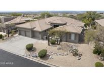 Stunning desert home with a three car garage and drought tolerant landscaping at 16706 N 109Th Way, Scottsdale, AZ 85255