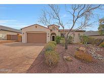 Charming single-story home featuring a well-manicured front yard and a spacious two-car garage at 27255 N 81St Ln, Peoria, AZ 85383