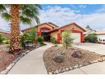 Charming front yard featuring desert landscaping, a palm tree, and a cozy bench at 3363 W Lone Cactus Dr, Phoenix, AZ 85027