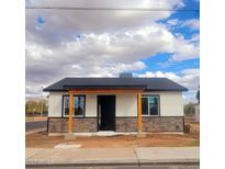 Charming home featuring stone accents and a covered entryway, awaiting your personal touch at 537 N Pasadena --, Mesa, AZ 85201