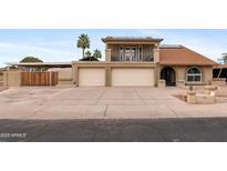 Charming two-story home featuring a two-car garage, balcony, and landscaped front yard at 6240 W Cortez St, Glendale, AZ 85304