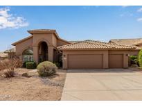 Charming single-story home boasts a well-manicured desert landscape and a three-car garage at 9393 E Hunter Ct, Scottsdale, AZ 85262