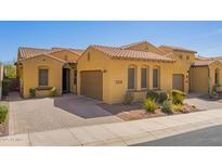 Charming single-story home featuring a terracotta roof, desert landscaping, and a two-car garage at 23133 N 73Rd Pl, Scottsdale, AZ 85255