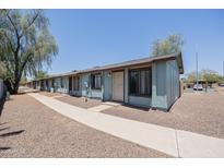Quaint single-story townhouse with a secure entry gate and easy-to-maintain landscaping at 3646 N 67Th Ave # 12, Phoenix, AZ 85033