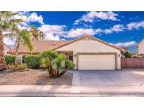 Charming single-story home showcasing desert landscaping and a two-car garage at 5437 E Grandview Rd, Scottsdale, AZ 85254