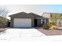 Charming single-story home featuring a two-car garage, low maintenance landscaping, and neutral tones at 625 W Panola Dr, San Tan Valley, AZ 85140