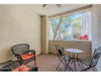 Relaxing outdoor patio features comfortable seating and views of mature trees and neighborhood architecture at 9750 N Monterey Dr # 50, Fountain Hills, AZ 85268