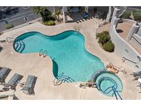 Aerial view of a community pool, hot tub and lounge chairs with desert landscaping and stair access to other amenities at 9750 N Monterey Dr # 50, Fountain Hills, AZ 85268