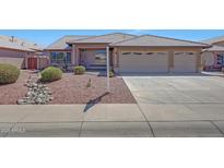 Charming single-story home with a well-maintained yard and a three-car garage, perfect for comfortable living at 10913 W Chino Dr, Peoria, AZ 85373