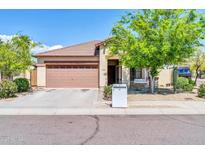 Charming single-story home showcasing a well-kept front yard, covered entry, and a two-car garage at 17008 W Sonora St, Goodyear, AZ 85338