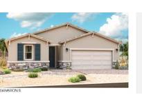 Charming single-story home featuring stone accents, a two-car garage, desert landscaping and shuttered window at 2667 N 195Th Dr, Buckeye, AZ 85396
