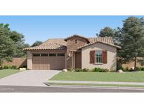 Charming single-story home featuring a stone facade, attached two-car garage, and inviting front lawn at 3396 E Open Prairie Dr, San Tan Valley, AZ 85140