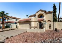 Charming two-story home with a two car garage, rock landscaping and tiled roof at 448 E Wescott Dr, Phoenix, AZ 85024