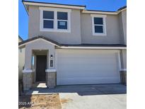 Charming two-story home with a two-car garage and neutral stucco exterior at 1127 E Mcneil St, Phoenix, AZ 85042