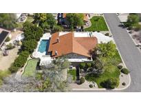 Expansive backyard featuring pool, spa, putting green, and well-manicured landscaping at 1530 E Jeanine Dr, Tempe, AZ 85284