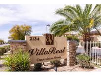 Villa Real Condominium Homes entrance sign with manicured landscaping and mature palm trees at 2134 E Broadway Rd # 1016, Tempe, AZ 85282