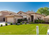 Charming single-story home featuring a well-manicured lawn and desert landscaping for added curb appeal at 3872 S Seton Ave, Gilbert, AZ 85297
