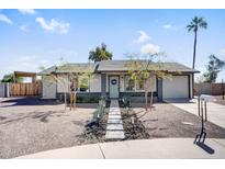 Charming single-story home featuring desert landscaping, neutral paint, modern accents, and a welcoming front door at 17849 N 35Th Pl, Phoenix, AZ 85032