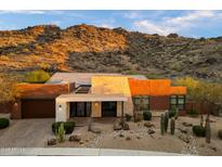 Front exterior showcasing desert landscaping and views of the McDowell Mountains at 9539 S 13Th Way, Phoenix, AZ 85042