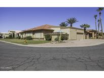 Charming single-story home featuring a desert landscape, tile roof and two car garage at 1214 E Clearview Dr, Casa Grande, AZ 85122