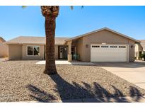 Charming single-story home with a well-maintained front yard and desert landscaping at 1715 Leisure World --, Mesa, AZ 85206