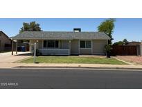 Charming single-story home featuring a well-maintained lawn and a welcoming covered porch area at 332 N 25Th St, Mesa, AZ 85213