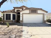 Inviting two-story home with a well-maintained yard, neutral paint, and a spacious two-car garage at 4643 E Cherry Hills Dr, Chandler, AZ 85249