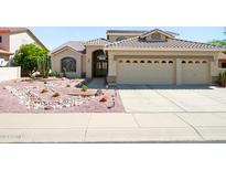 Charming single-Gathering home featuring a low-maintenance desert landscape and three-car garage at 511 W Cherrywood Dr, Sun Lakes, AZ 85248