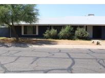 Quaint single story home with mature trees and low maintenance landscaping at 6319 E Albany St, Mesa, AZ 85205