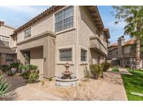 Charming stucco townhome featuring a well-maintained courtyard and decorative fountain at 10017 E Mountain View Road -- # 1045, Scottsdale, AZ 85258